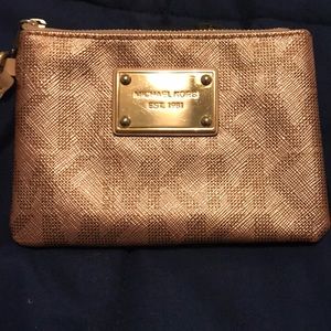 Authentic Michael Kors coin purse in shiny taupe
